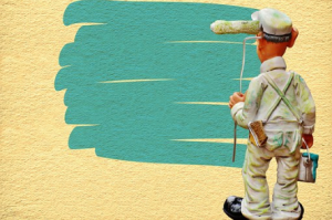 man painting a wall